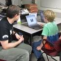 Child accesses outreach activity on his computer screen.